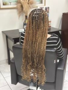 waist length honey blonde knotless braids